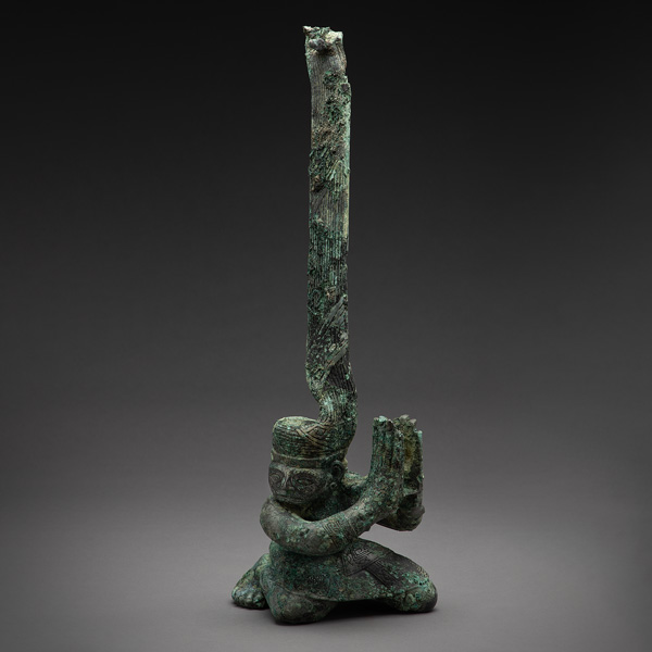 Kneeling figure with twisted head 