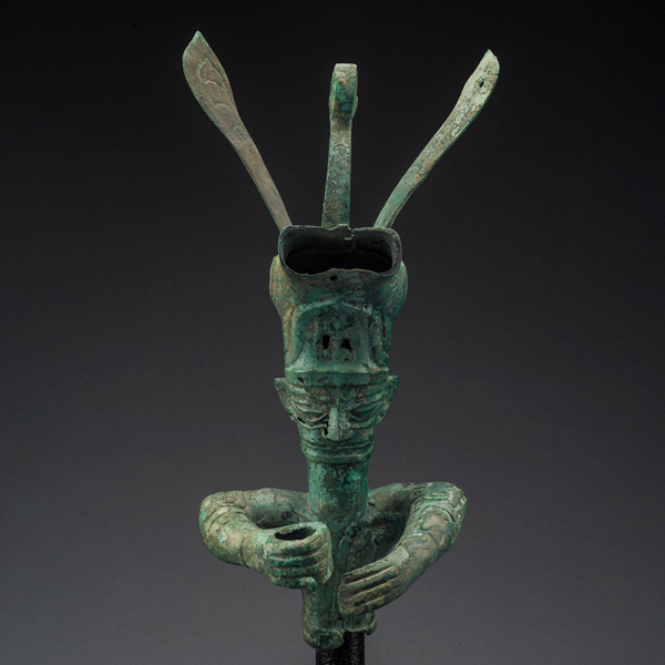 Figure with animal headdress