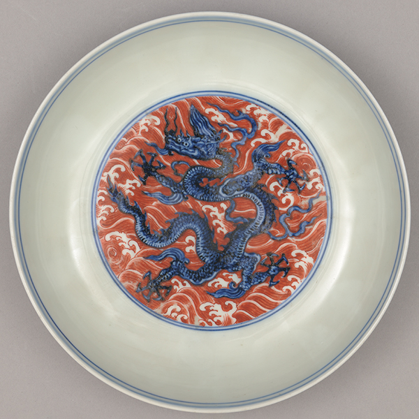Dish with dragons among waves