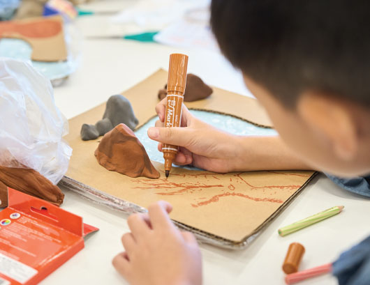Participants use craft materials to create theatre props