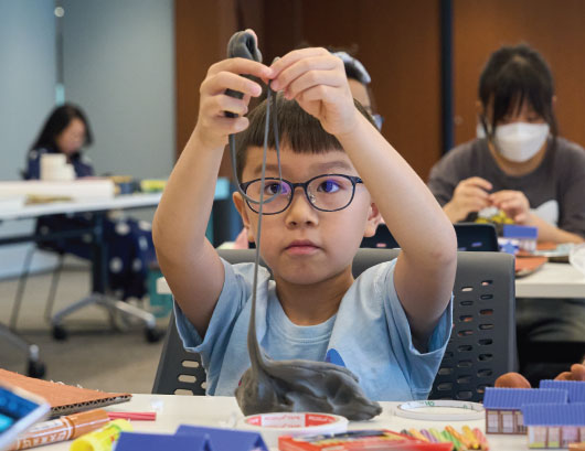 Participants use craft materials to create theatre props