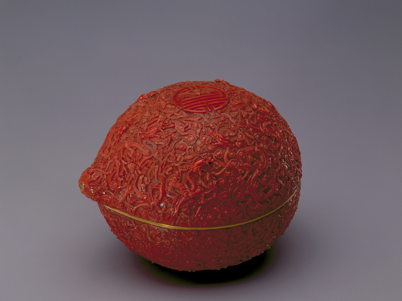 Peach-shaped box with dragons, clouds, waves, and “shou” (longevity) character