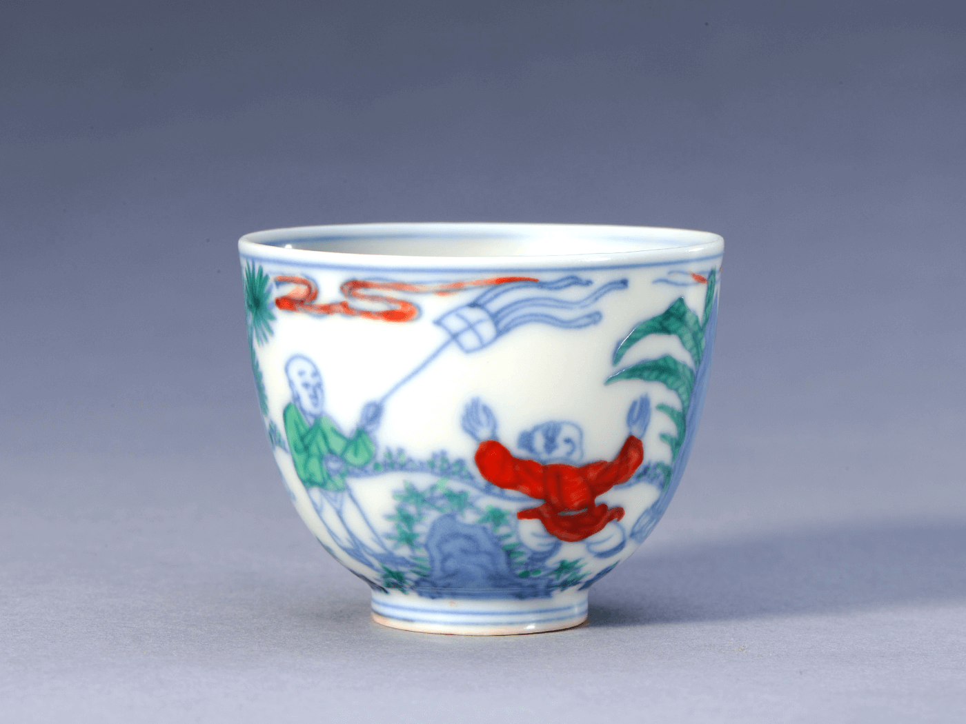 Cup with boys at play